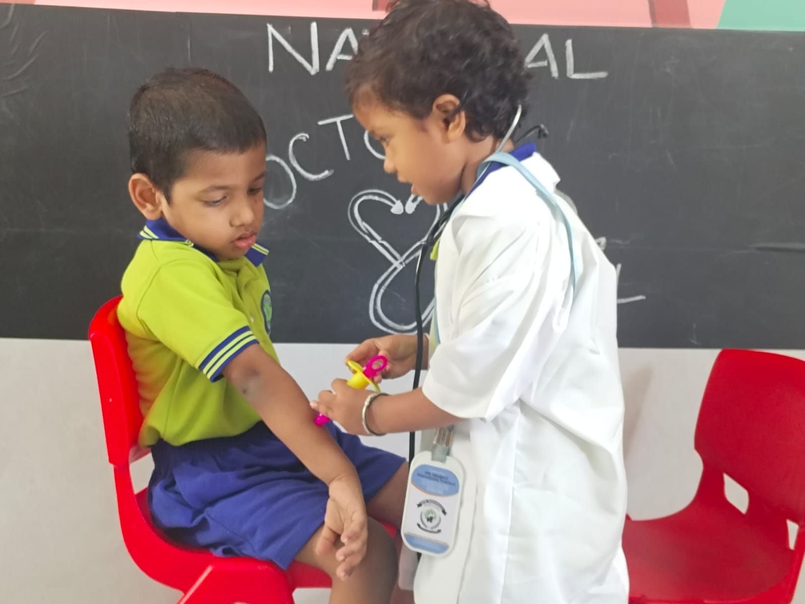 Dramatic play corner: a student dressed as a doctor for National Doctors' Day
