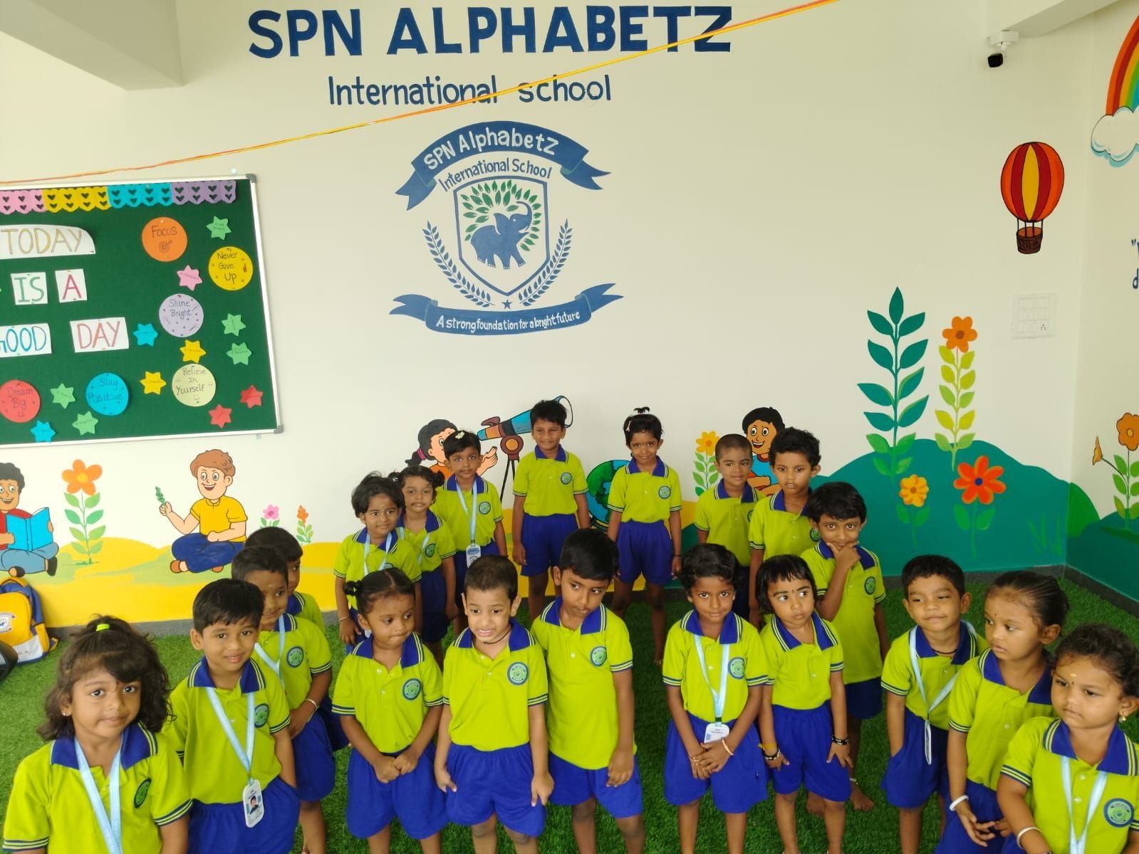 Happy students of SPN AlphabetZ International School posing together on campus