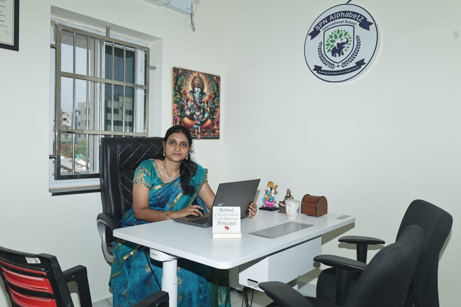 The Principal of SPN AlphabetZ International School at her desk