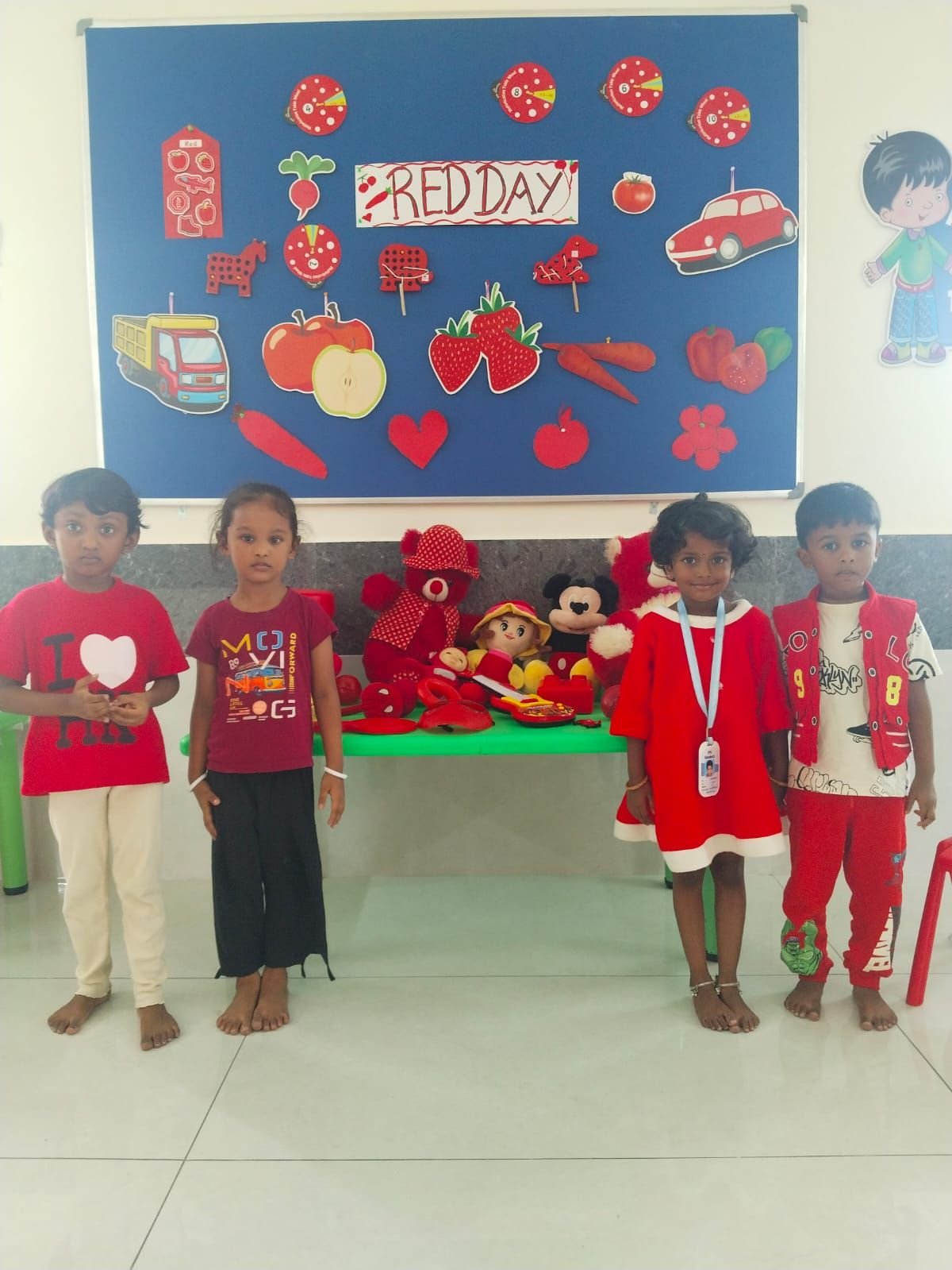 Students celebrating Red Day with themed props