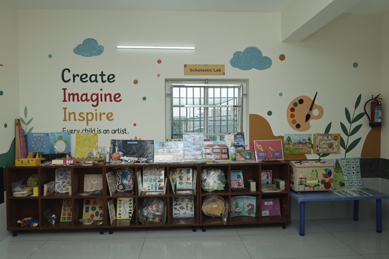 The Scholastic Lab shelf, stocked with hands-on learning materials