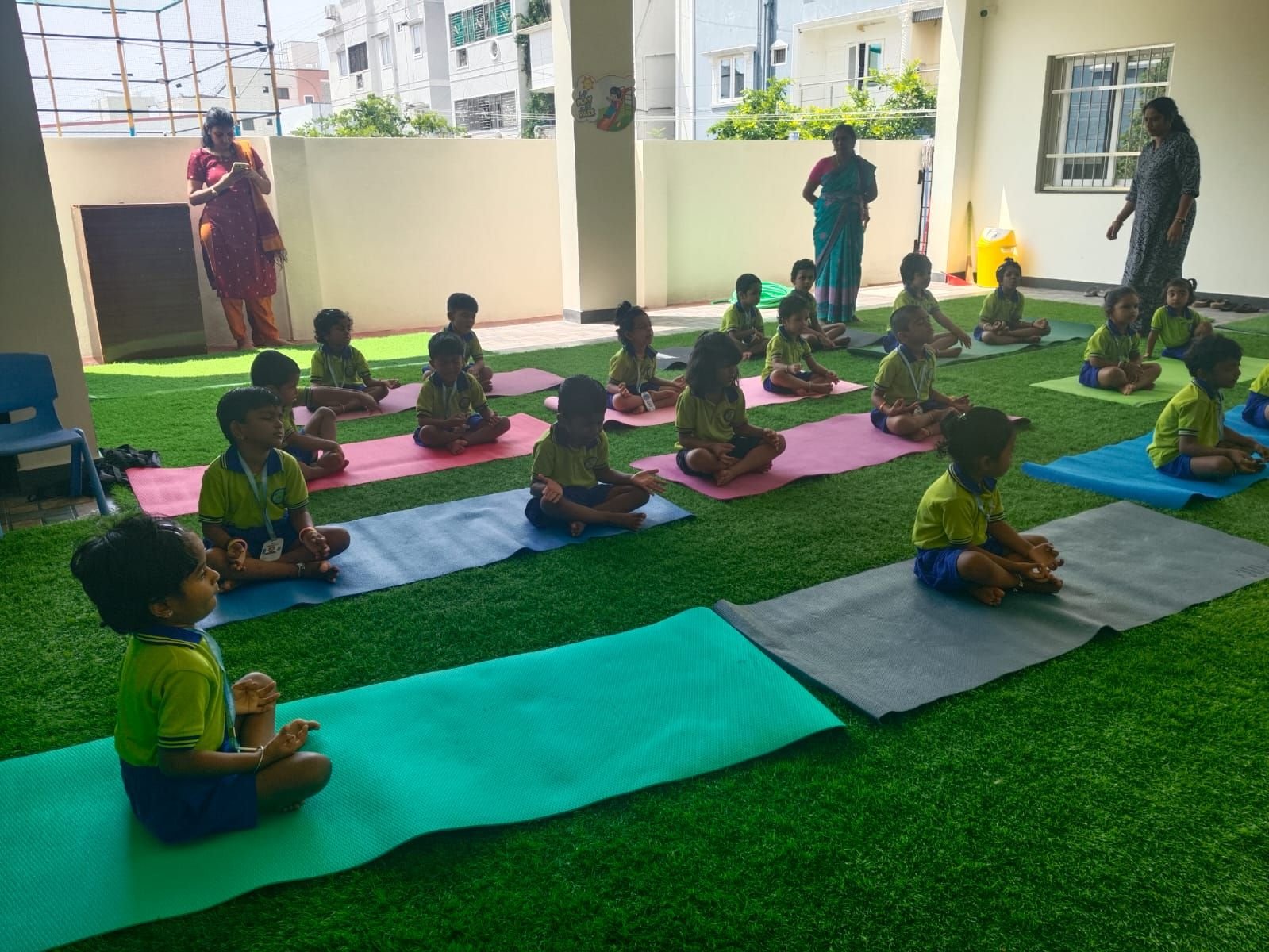 An outdoor yoga and mindfulness session on the terrace lawn